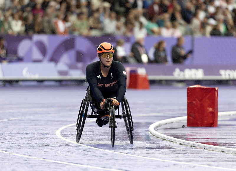 Eden Rainbow Cooper in her racing chair at the start line of a race 